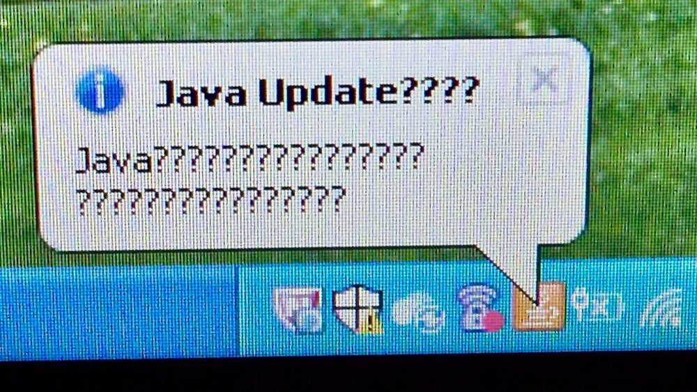 Balloon tip from the Java application in the notification tray titled “Java Update????” with a description saying “Java???????????????? ????????????????”