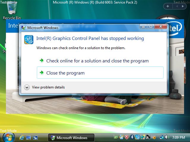 Windows Vista Desktop screenshot, showing a crash dialog saying Intel Graphics Control Panel has stopped working. Behind it, there's a loading screen for the Intel Graphics Control Panel.