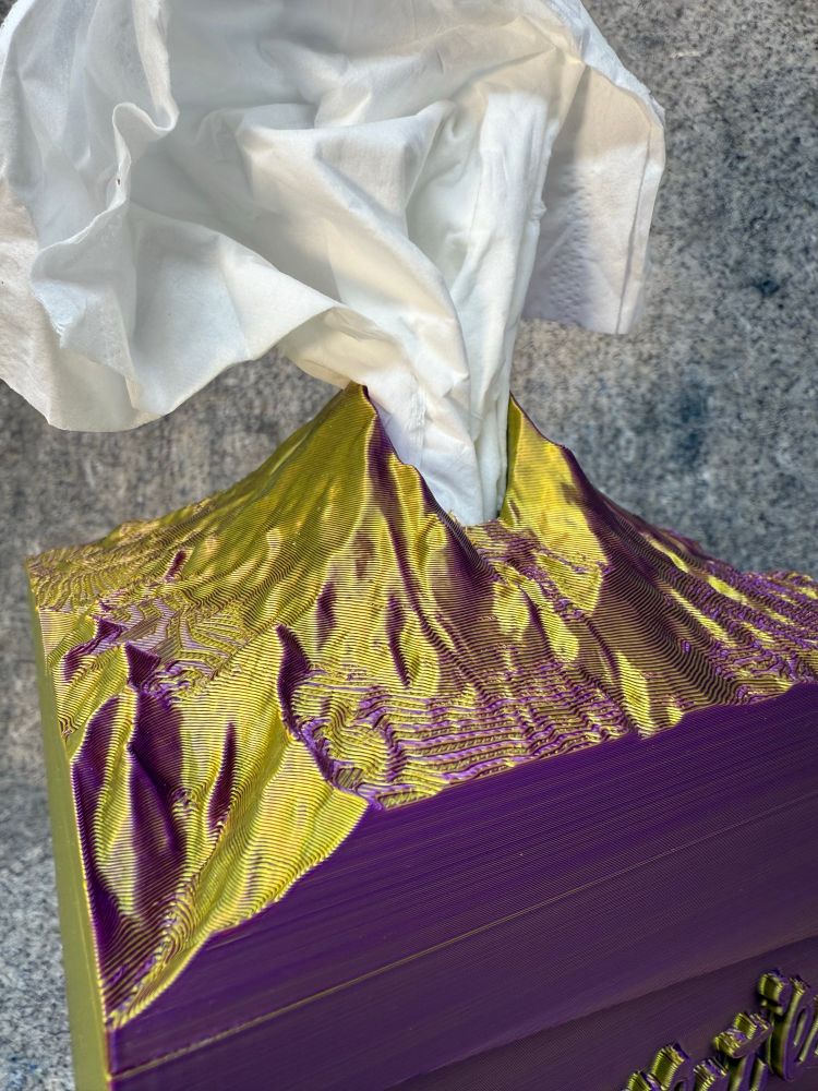 Mount Saint Helens 3-D printed tissue box cover top that is printed in purple and gold so it looks purple in One Direction and gold in the other direction