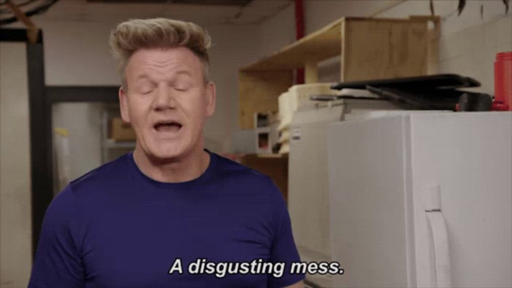 a man says a disgusting mess in front of a white refrigerator