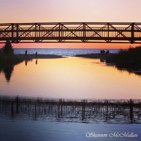 Sunset reflection at footbridge on the beach boardwalk at Providence Bay on Manitoulin Island