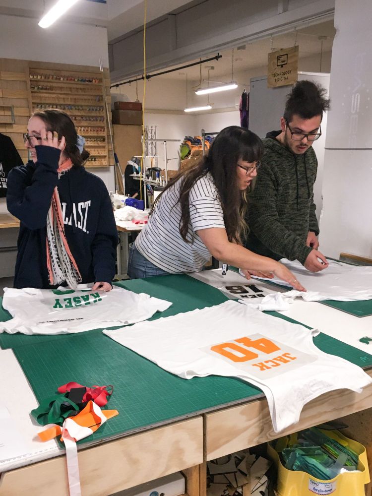 Young people working on customising T-shirts with HTV.