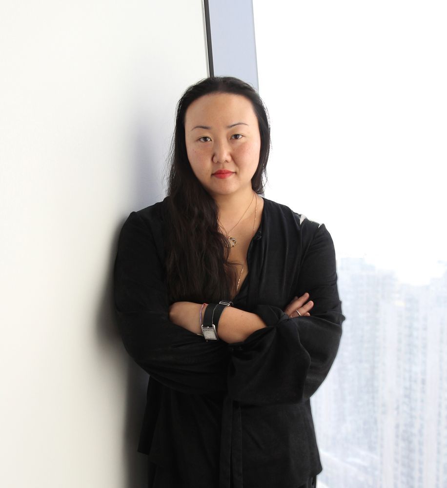 Hanya Yanagihara in a black top against a white background