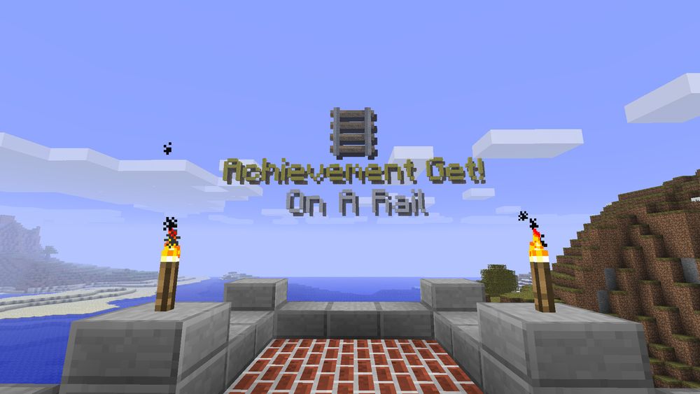 A monument constructed at the end of a railway that reads "Achievement Get! On A Rail" with pixel art of a Rail above it.