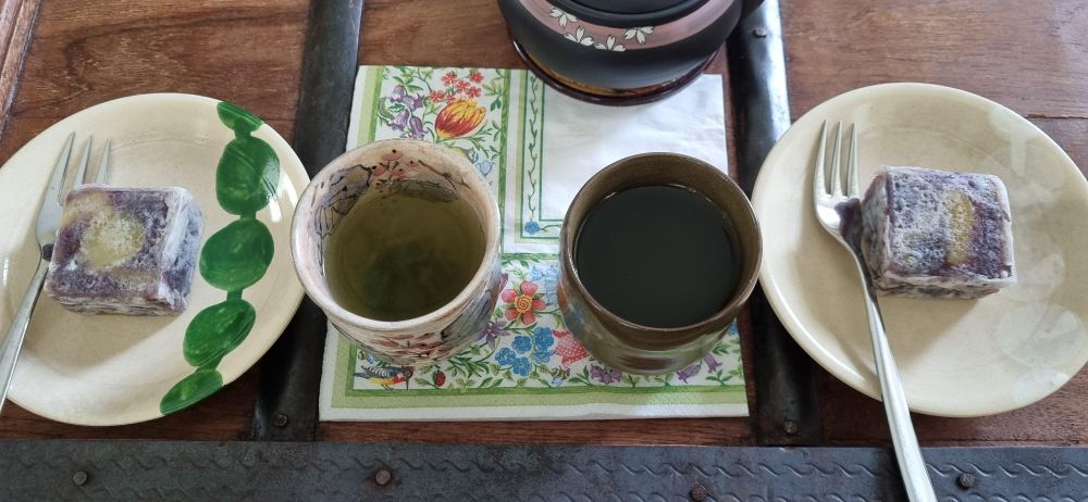 My photo of our afternoon tea today comprising Uji green tea steeped at 70°C and Japanese traditional autumn sweets kuri kintsuba served on kyo-yaki wagashi plates (another souvenir from an earlier Japan trip decades ago).