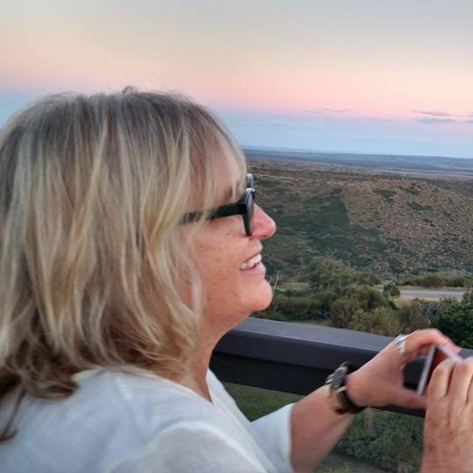 Blonde lady watching sunset 