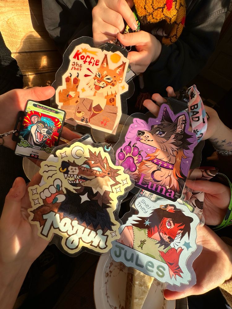 Photo showing five furry badges