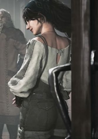 Almas cuntiest fit, a white long-sleeve with dark gray overalls that are rolled up



















Alma backshott...