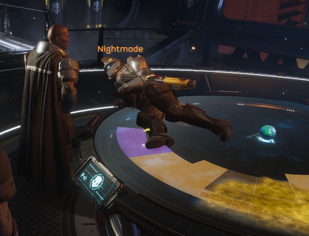 A Helldivers 2 game character in full armor lounging on their side on top of a galactic war table you are not usually supposed to get on. The player character is looking longingly at the NPC democracy officer, paying attention to the officer intently but maybe not exactly to their every word. More like, enjoying their energy.