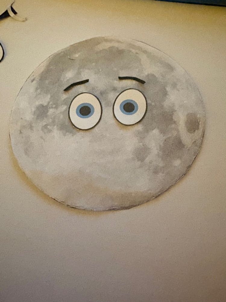 Moon with eyes and “pensive” eyebrows.