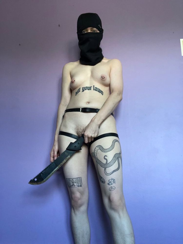 leather waist harness, machete, ski mask, tits