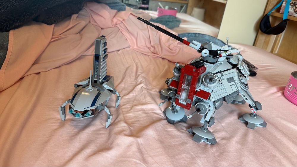 LEGO Star Wars set #75019, 2013 AT-TE. And LEGO Star Wars set #8036, 2009 Separatist Shuttle. Sitting on my bed next to the doggy bowl ice been eating ice cream out of while building them.