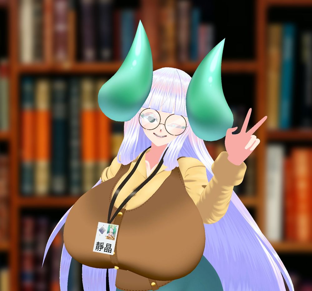 Jing posing in front of a blurred-out bookshelf background, smiling to the camera, winking, and flashing a peace sign with one hand.