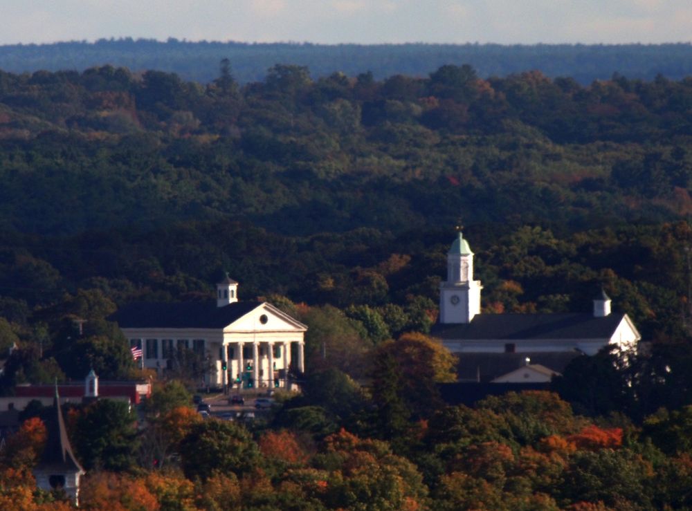 Stetson Hall, 6 South Main St and First Congregational Church, 1 South Main St both in Randolph MA as seen from Buck Hill. 