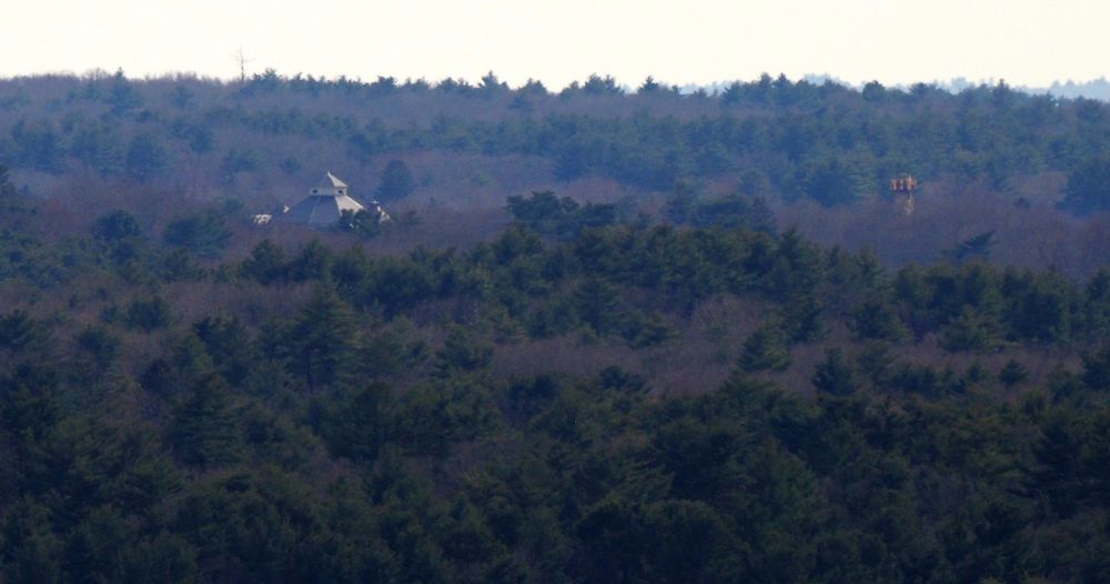 Stoughton Town Hall, 10 Pearl St and a smokestack, Trackside Plaza, 2 Canton St both in Stoughton MA, photographed from Buck Hill.