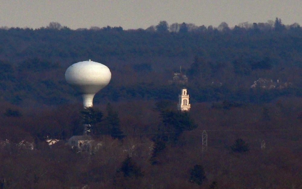 Weymouth Town Hall, 75 Middle St and a water tower, 1 Calnan Cir both in Weymouth MA, photographed from Buck Hill.