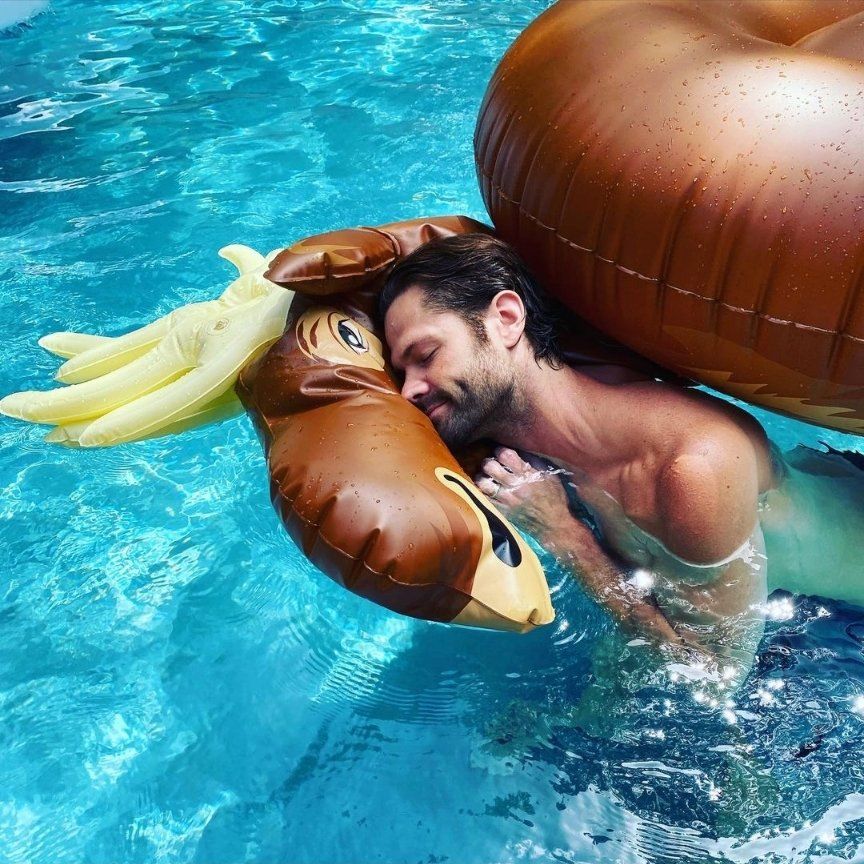 Jared Padalecki in the pool with a moose pool float.