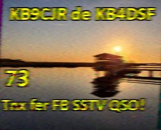 SSTV call sign image featuring a jetty on a lake at sunset