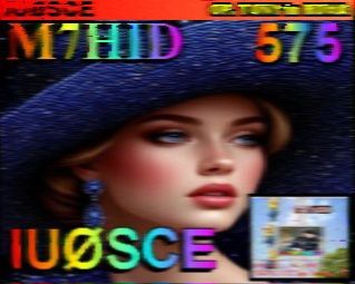 SSTV call sign image of digital image of a woman with blonde hair and wearing a wide brimmed navy coloured hat. Wearing blue drop earrings and a matching top. Has the radio call sign IUØSCE overlaid across the bottom, M7HID at the top to the left, and 575 at the top right, all in rainbow letters 