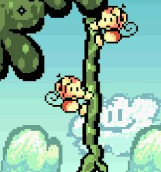 a close up of two ukikis, small little monkeys, staring at the ground