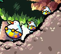 a close up of a trio of huffin puffings, round birds with yellow polka dots on their pants
