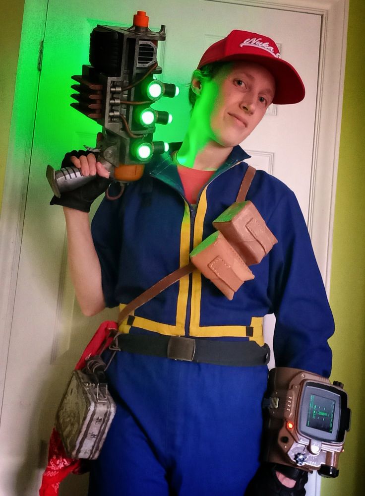It's me wearing my simple Fallout cosplay for halloween. A blue "vault" boiler suit, a plasma pistol with glowing green lights in my hand. A red nuka cola baseball cap, a Pip-Boy device on my wrist, 2 leather ammo pouches on a belt across my chest and a vault-tec tin lunchbox hanging from my waistbelt.