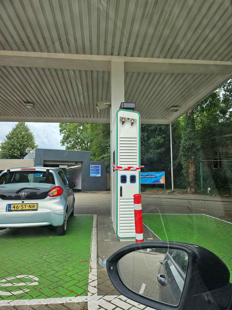 Picture from inside my car, showing a closed off charger with its cables cut-off. The cables have likely been stolen for it's copper value