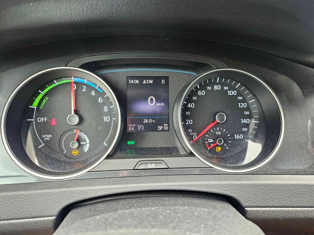 Photo of my car's dashboard. It's showing an estimated remaining range of 10km, together with a Turtle icon (meaning it's limited to 90km/h and 20kW), and an orange fuel nearly empty indicator. 