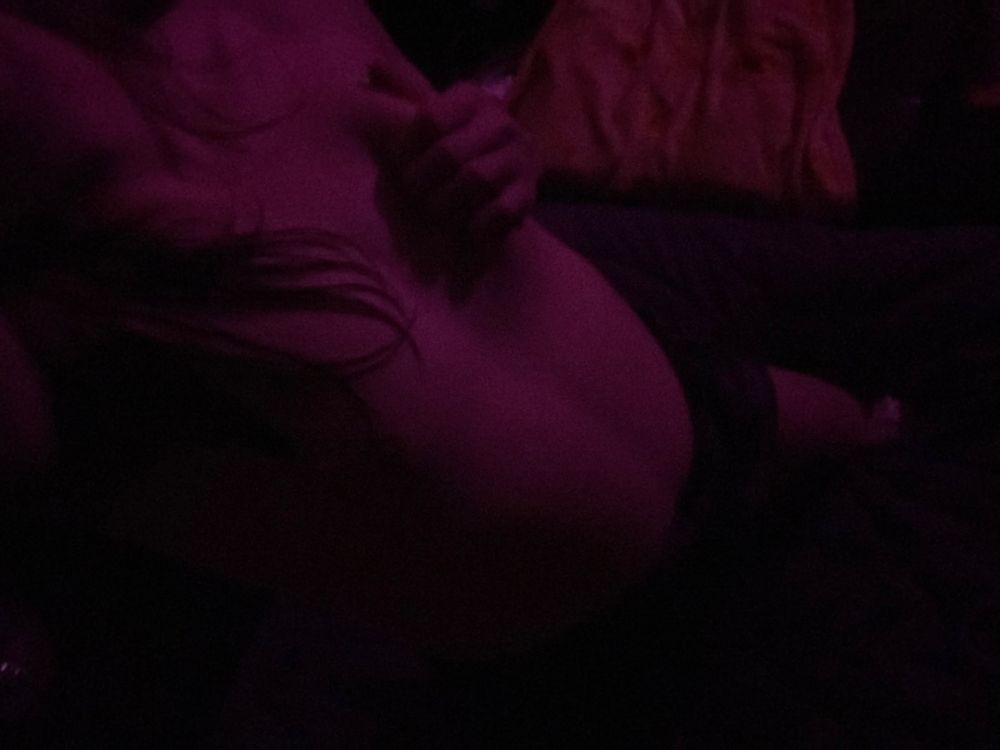 Ash in only shorts leaning back exposing cute little titties and tummy