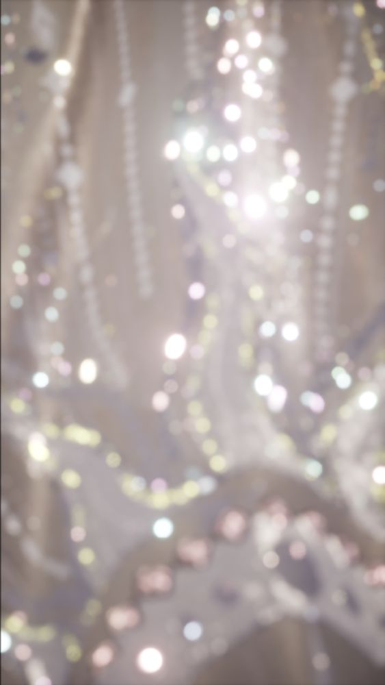 a blurry closeup of nikki's glittery cape