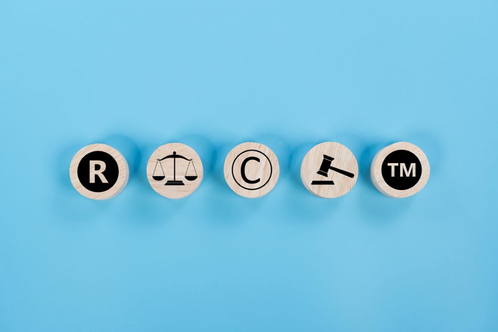Photo of copyright symbol or intellectual property rights of patentee on wooden cubes.