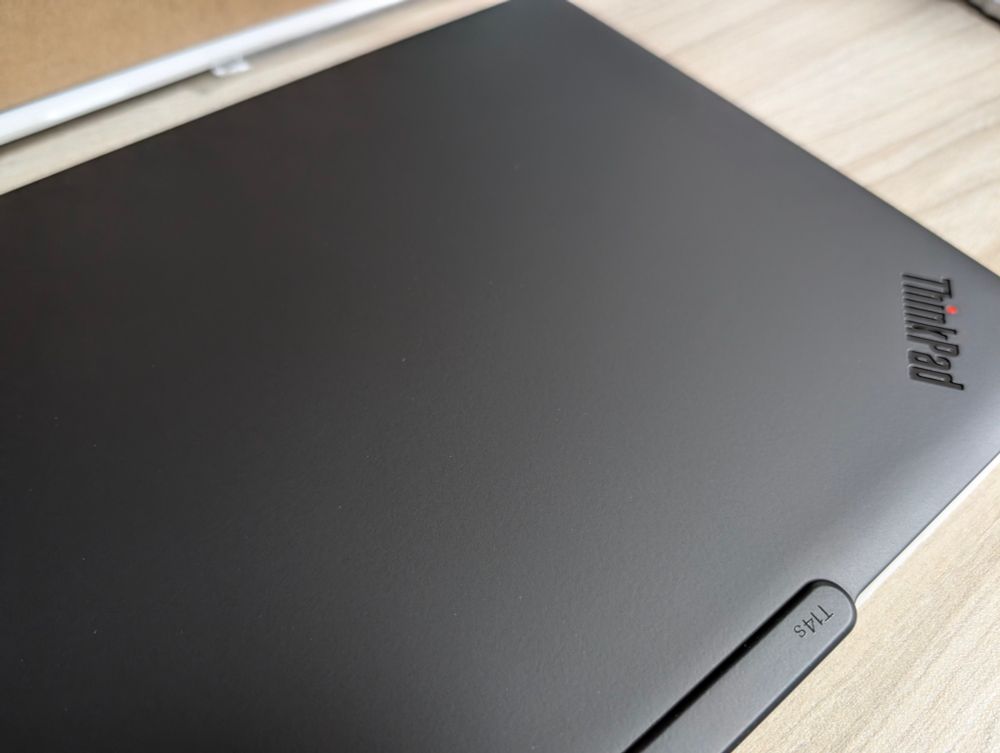 ThinkPad T14s Gen 6 laptop model on the desk.