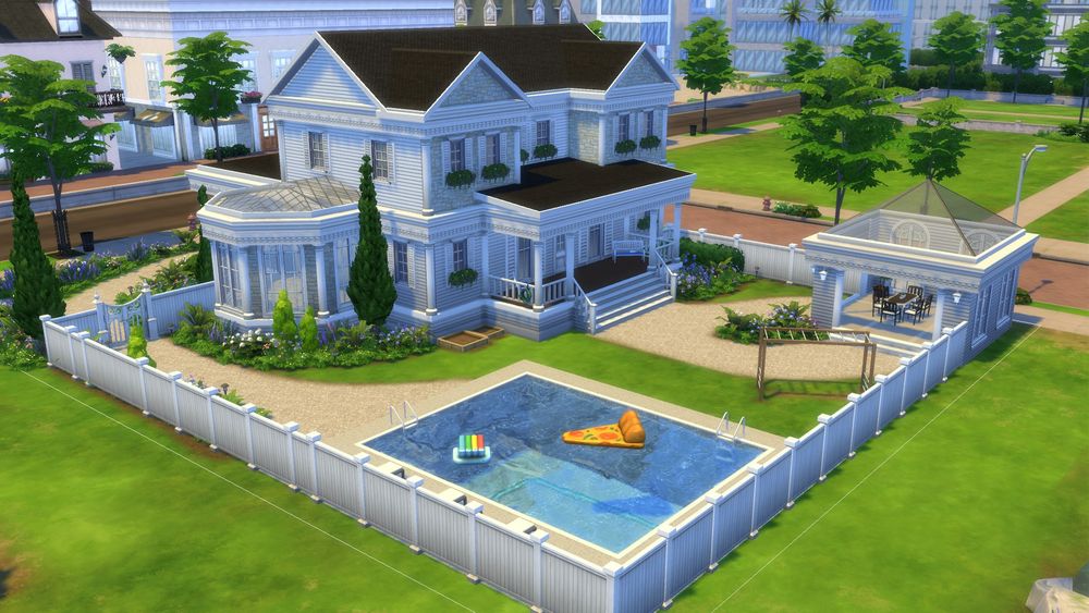 Back of house with a pool and gazebo