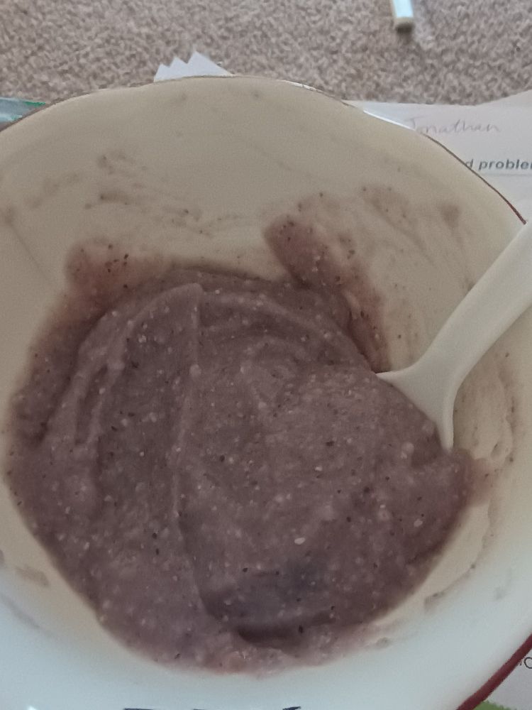 Bowl with blue cornmeal porridge and a plastic spoon. 

Recipe: bring 2 cups of water to a boil. Add cornmeal 2 tablespoons at a time stirring constantly until it thickens. Cook on heat for 2-3 minutes, continuing to stir.

Pull from heat and add butter, sugar (or favorite sweetener) salt, and vanilla extract to taste. Mix thoroughly, then add frozen berry mix to help cool it down. Serve in bowls, top with milk or cream if desired. 

Variations: 
Add only blueberries or blackberries to boost the color. 

Use yellow cornmeal instead of blue and add yellow berries, Clementine slices, and red raspberries to make sunrise porridge.

Add cinnamon for a yellow cornmeal porridge, and add cardamom for the blue. 

When this cools the porridge will congeal. This can be cut in slices and fried, then served with honey drizzled on top.

Enjoy!