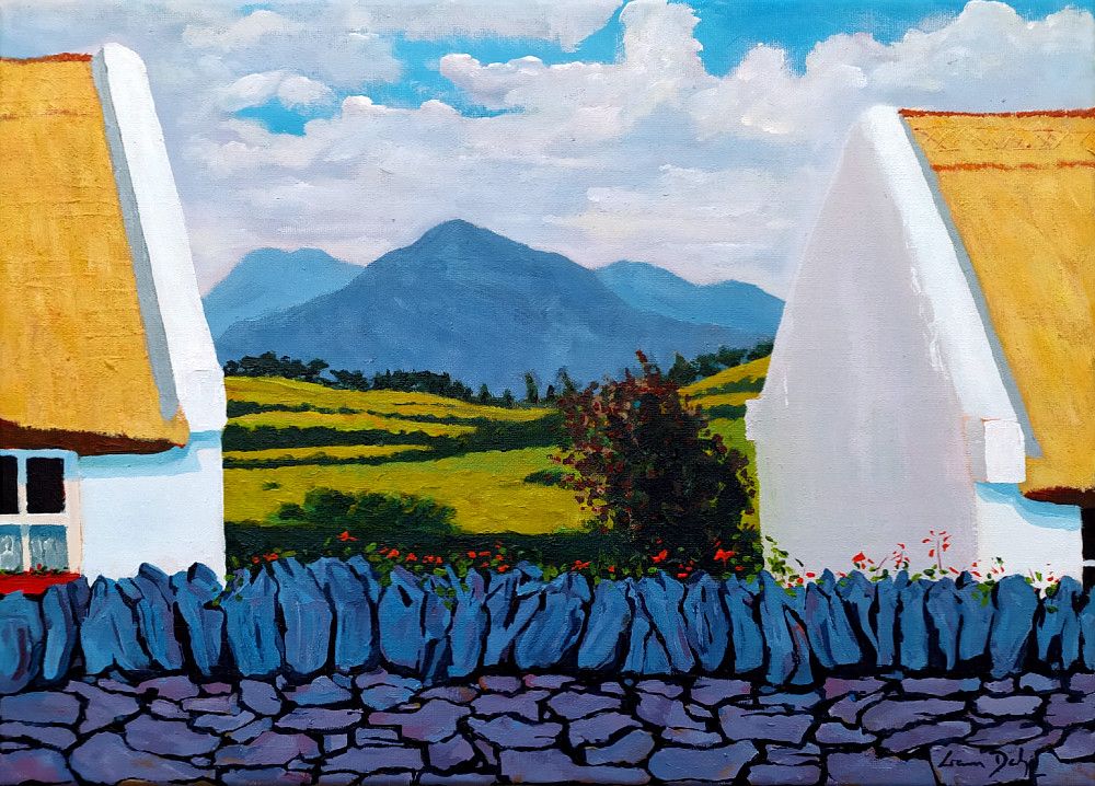 Landscape format in acrylics on canvas. Behind a purple stone wall with black gaps and crevices and topped with blue upright stones and small orange flowers along their tops, are the visible ends of two neighbouring white-washed single-story thatched cottages and in the gap between them is patchwork of pale green fields separated by dark green hedgerows sloping up from the centre and topped behind a tree-filled distant hedgerow by a pyramidal blue rocky peak, with paler blue peaks behind it on both sides, of the Twelve Bens mountain range. A front-facing window on both cottages is cropped by the respective edge of the painting, and the view through the gap is slightly off-centre such that we see the gable of the cottage on the right, in slight warm shadow. Blue sky at the top peeks through white fluffy clouds with pale grey bottoms. Signed bottom right: Liam Daly
