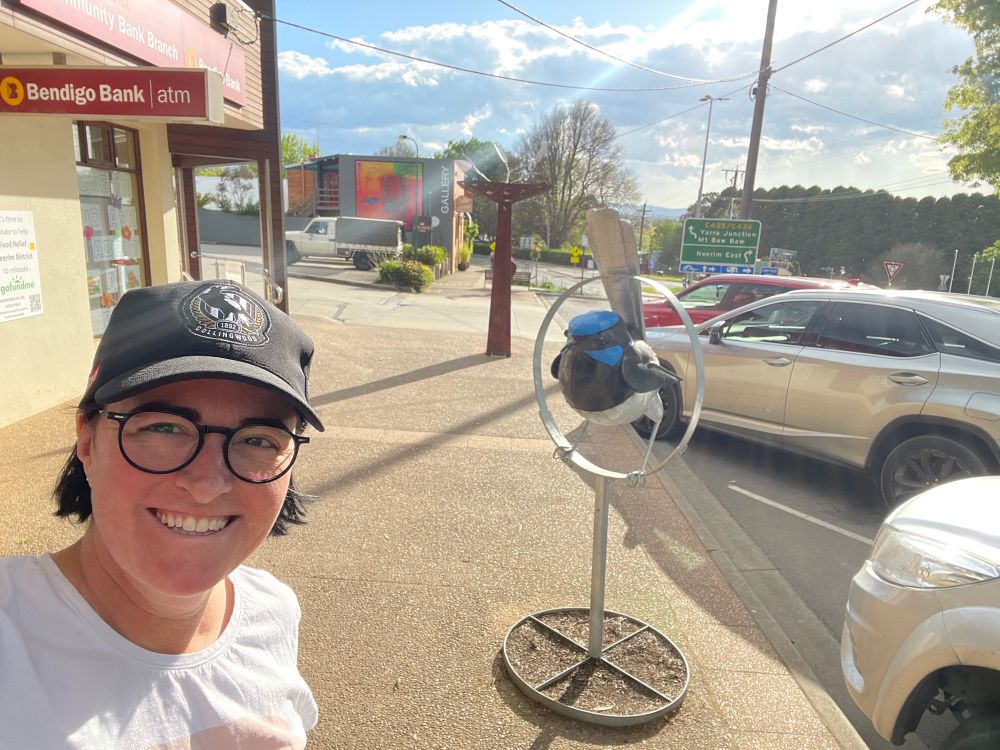 Clare in front of a fairy wren art piece at Neerim south