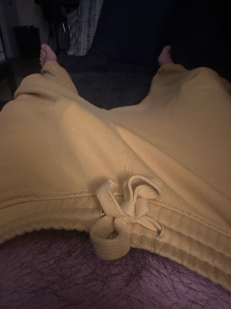 My hard cock print through my yellow sweatpants