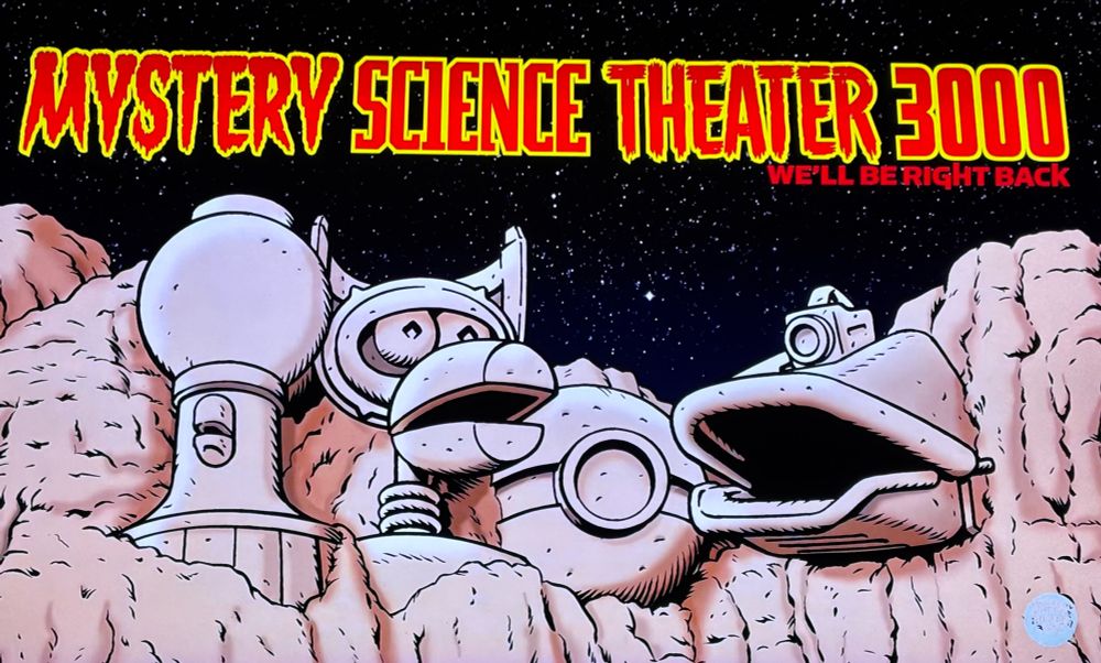 Screen cap of the between-ads image from the Mystery Science Theater 3000 marathon. It’s a drawing of Tom Servo, Crow T. Robot, Cambot and GPC on Mount Rushmore 
