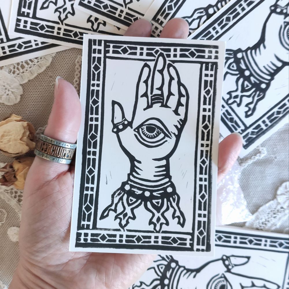 Linoprint of a hand with an eye. Occult vibe
