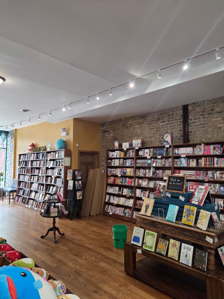 A photo of Goblin Market with fixtures moved and a large green bucket in the middle of the store