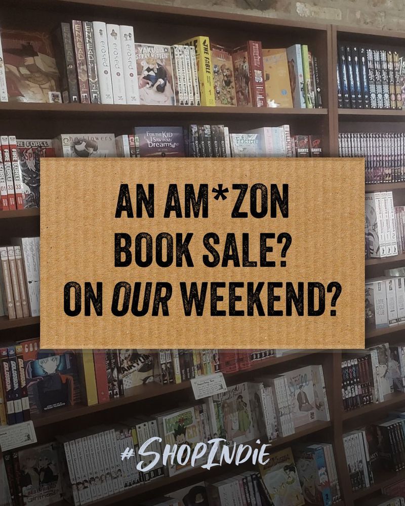 An Amazon Book Sale on Our Weekend? Typed on cardboard in front of a bookshelf at Goblin Market