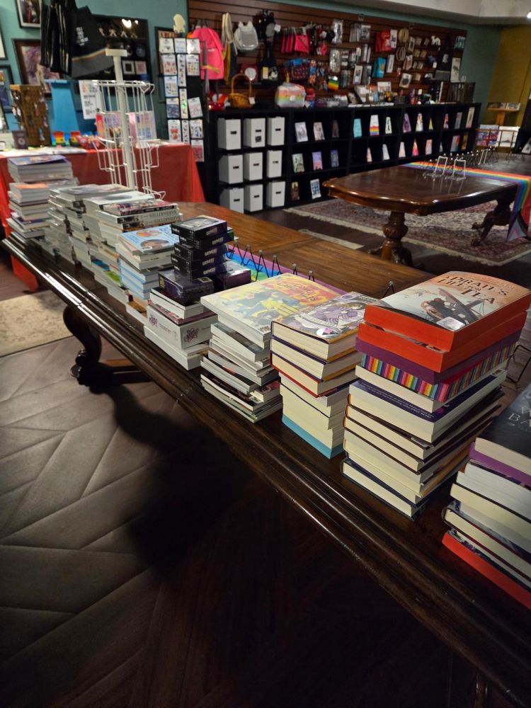 Stacks of books on a table in the Goblin Market art and community space 