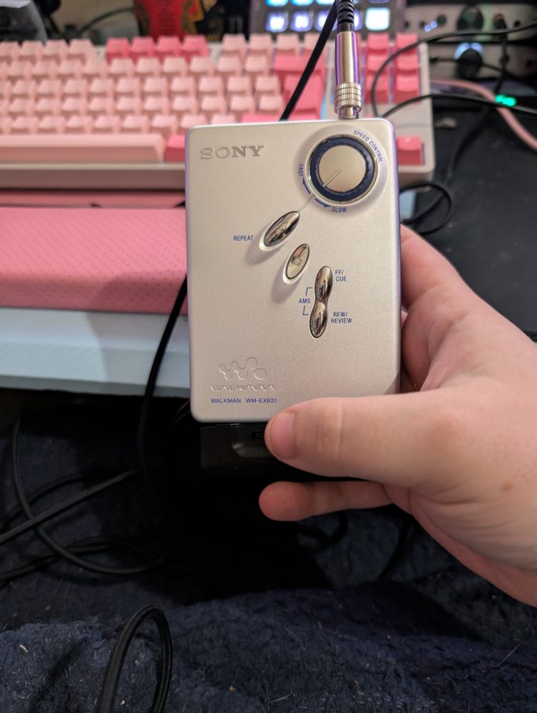 Front side of Walkman EX-631 with the speed control wheel and playback buttons 
