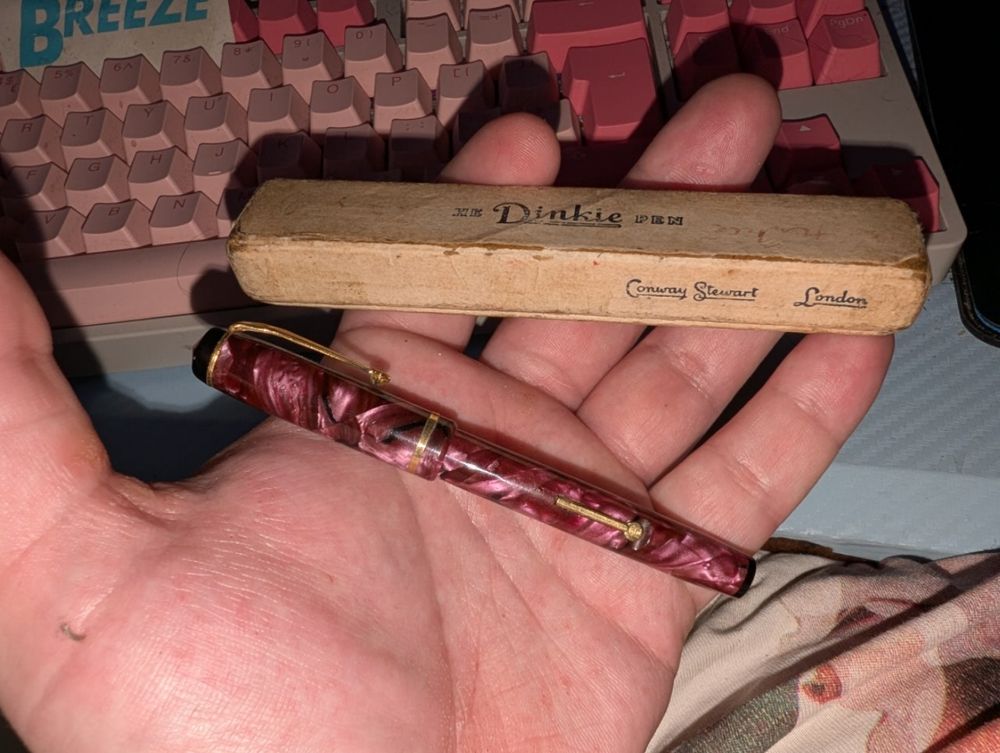 The pen and box in my hand 