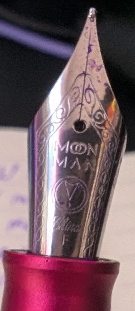 Close up photo of the pens nib 
It's enscribed "moon man" 