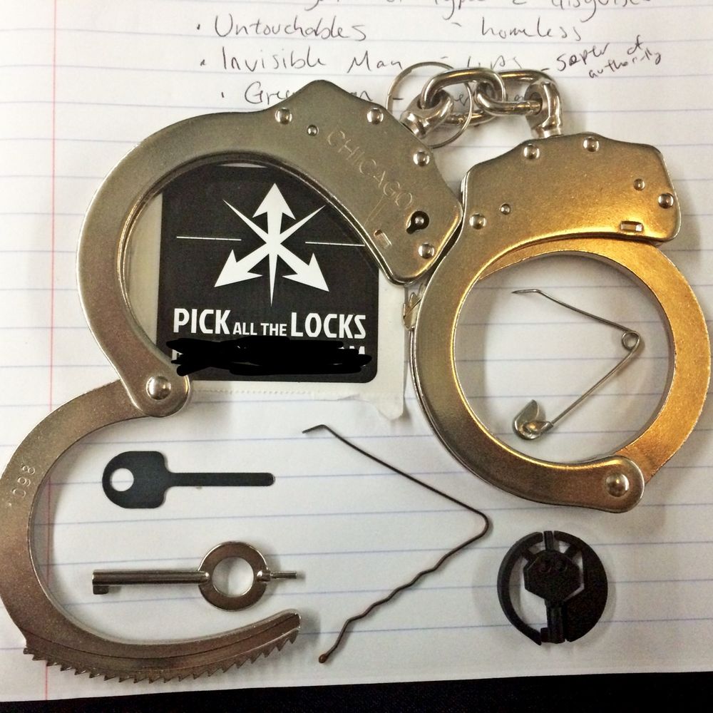 Handcuffs, shims, handcuff keys, safety pin.