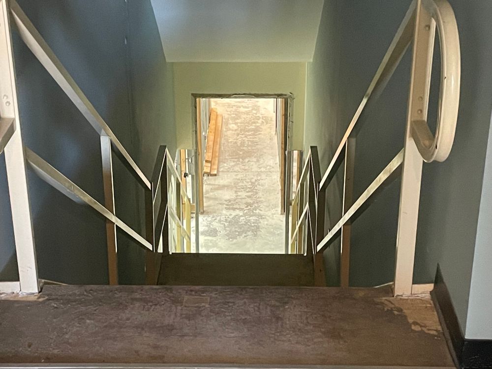 Shot of a set of stairs from the top landing, looking down at the entrance at the bottom. We’re totally going to back light the hell out of this and do somethings like that one iconic shot of all the possessed people in Demons running down the lobby.