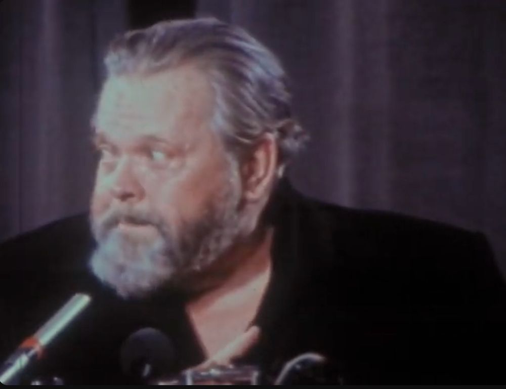 Still shot of Orson Welles from a famous interview her gave wherein he called out Elia Kazan.