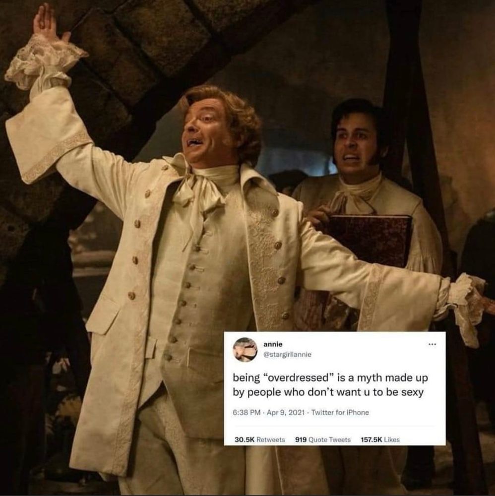 Stede making a flamboyant entrance with the text "being 'overdressed' is a myth made up by people who don't want u to be sexy"