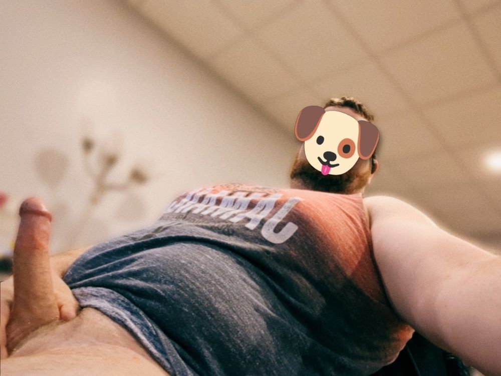 Me reclining in a computer chair holding my hard cock